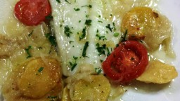 Recepta de cuina de Bacallà al forn amb patates i ceba