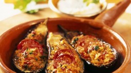 Recepta de cuina de Albergínies farcides amb arròs