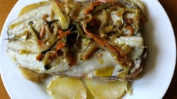 Recepta de cuina de Verat al forn sobre llit de patates
