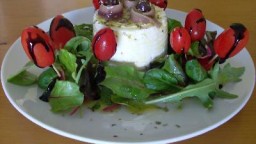 Recepta de cuina de Amanida de formatge fresc, tomàquets xerri i anxoves