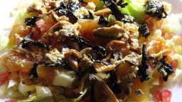Recepta de cuina de Amanida d'enciam, poma confitada, bolets i magrana