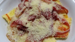 Recepta de cuina de Raviolis de formatge parmesà i tòfona amb pernil ibèric i ou trencat