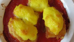 Recepta de cuina de Bacallà a la muselina d'all gratinat sobre llit de salsa de tomàquet