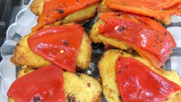 Recepta de cuina de Llom arrebossat amb pebrots del piquillo i formatge ratllat