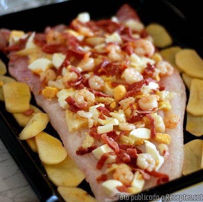 Recepta de cuina de Suprema de merluza del pincho a la espalda con langostinos de lonja
