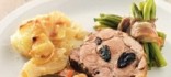 Coll de porc rostit amb prunes seques a l’estil del Cantó d'Argovia