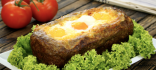 Pastís de carn farcit amb pernil, formatge i ou